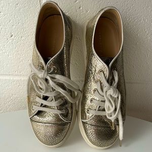 Charlotte Olympia gold flake leather sneakers with spiderweb detail on tongue